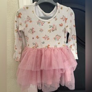 Posh peanut dress with long sleeve flannel top and tulle dress